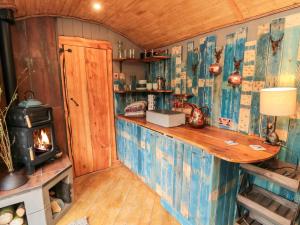 a kitchen with a counter and a stove in a room at The Hideaway, Shepherd's Hut in Scarborough