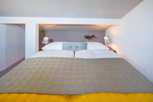 Postelja oz. postelje v sobi nastanitve Hotel Rössli