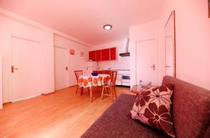 a living room with a couch and a table at Sea View Apartment in Zadar in Zadar