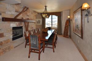 a dining room with a table and chairs and a fireplace at Stunning penthouse with 3,600 sq, ft, of luxury in Park City