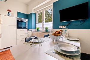 a kitchen with a table with a bowl of food on it at Wohnen in der alten Post in Meckenbeuren