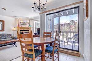 a dining room with a table and chairs at River Mtn Lodge W110C in Breckenridge