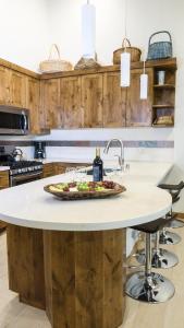 a kitchen island with a plate of food on it at Ski Trails 4070 in Truckee