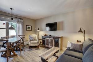 a living room with a couch and a table at River Mtn Lodge W301 in Breckenridge