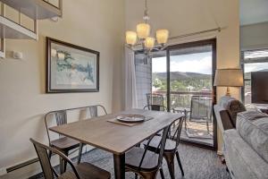 a dining room with a table and a couch at River Mtn Lodge E301 in Breckenridge