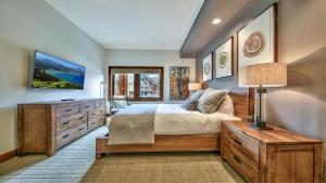 a bedroom with a large bed and a dresser at Zalanta 221 in South Lake Tahoe