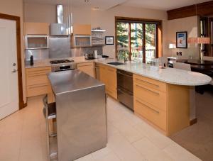 a kitchen with stainless steel appliances and a large island at Osprey 303 in Beaver Creek