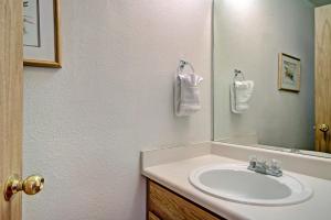 a bathroom with a sink and a mirror at River Mtn Lodge W219 in Breckenridge +20 photos