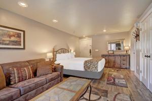 a living room with a bed and a couch at Village at Breck V4309 in Breckenridge