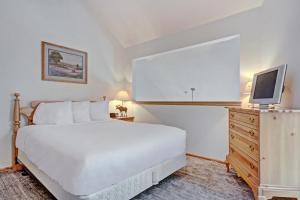 Ένα ή περισσότερα κρεβάτια σε δωμάτιο στο River Mnt Lodge E204