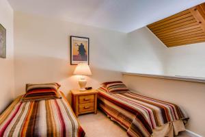 Postel nebo postele na pokoji v ubytování Axtel 1 Br Loft AX410