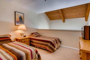 Postel nebo postele na pokoji v ubytování Axtel 1 Br Loft AX410