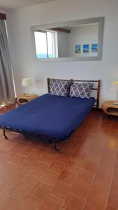 Ein Bett oder Betten in einem Zimmer der Unterkunft Ma vue mer en Algarve