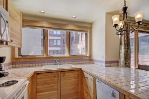 a kitchen with a sink and a window at Village at Breck V4224 in Breckenridge