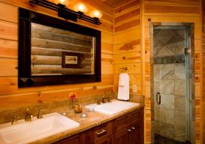 a bathroom with a sink and a shower at Trappers Cabin in Beaver Creek