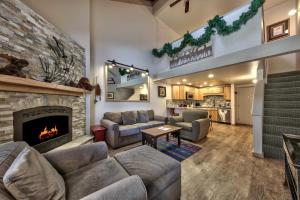 a living room with couches and a fireplace at Newly Remodeled 1 Bed and Loft at Lakeland Village in South Lake Tahoe