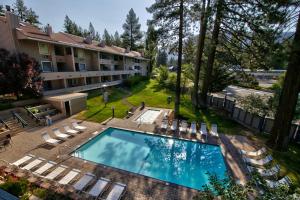 an aerial view of a hotel with a swimming pool and lawn at Newly Remodeled 1 Bed and Loft at Lakeland Village in South Lake Tahoe