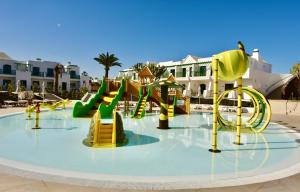 a water park with a slide in the middle at MYND Yaiza in Playa Blanca