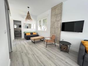 TV a/nebo společenská místnost v ubytování Playa de la Misericordia