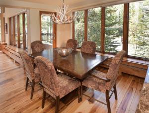 a dining room with a wooden table and chairs at The Pines 401 in Beaver Creek