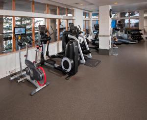 a gym with several treadmills and elliptical machines at The Pines 401 in Beaver Creek