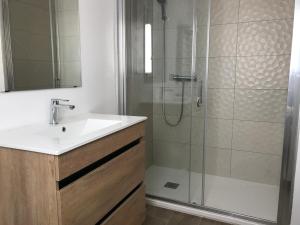 a bathroom with a sink and a shower at Casa Samsara Yaranda in Denia