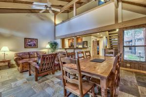 a dining room with a table and chairs and a couch at 511 Pine Grove in South Lake Tahoe