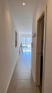a hallway with a room with a view of the ocean at Administración MAIPU 1C FI Depto Premium in Tandil