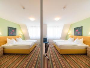 Katil atau katil-katil dalam bilik di PrivatHotel Probst