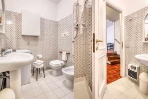 a bathroom with a sink and a toilet at Ciclamini 29 - Casa Casoni in Numana +19 photos