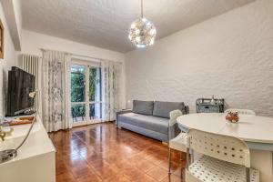 a living room with a couch and a table at Ciclamini 29 - Casa Casoni in Numana