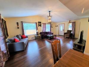 a living room with a couch and a table at Hogwarts -Themed Cabin in Olympics National Forest in Forks