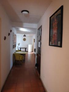 a hallway leading to a dining room with a table at Caracol in Puerto Vallarta