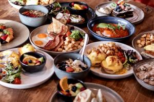 a table full of different plates of food at Delta Hotels by Marriott Grand Okanagan Resort in Kelowna