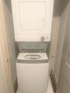 a white washer and dryer in a small room at Downtown Vine St Studio at The Guild in Cincinnati