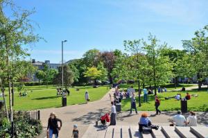 a group of people walking in a park at Skeffington Arms Hotel in Galway