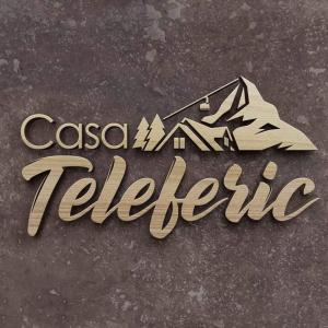 a sign that reads casablanca telltale with a mountain at Casa Teleferic in Buşteni