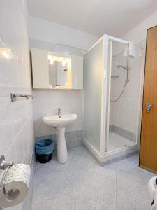 a bathroom with a sink and a shower at Hotel La Betulla in Bardonecchia