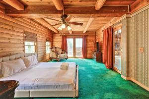 a bedroom with a bed and a ceiling fan at Mountain Bliss Chalet with Great Views! in Sonora