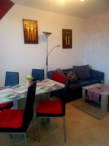 a living room with a table and a couch at CrisAnd 3 Panoramic in Altenau +18 photos