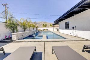 a swimming pool in the backyard of a building at Stylish Palm Springs Home with Outdoor Oasis! in Palm Springs