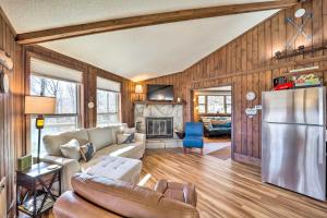 a living room with a couch and a refrigerator at 1/2 Mi to Skiing! Beech Mountain Cabin w/ Deck in Beech Mountain
