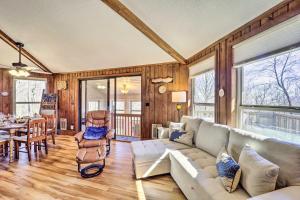a living room with a couch and a table at 1/2 Mi to Skiing! Beech Mountain Cabin w/ Deck in Beech Mountain +19 photos