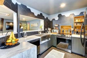 a kitchen with a bowl of fruit on the counter at Pet-Friendly Dryden Vacation Rental! 