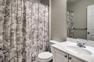 a bathroom with a toilet and a shower curtain at Maryland Vacation Rental Near Baltimore in Perry Hall +27 photos