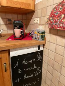 a home life sign on top of a kitchen appliance at Jurahaus Hirschberg EG Wohnung in Beilngries