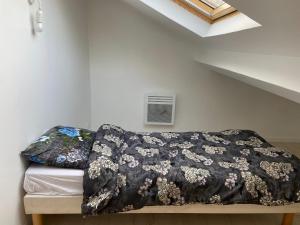 Posteľ alebo postele v izbe v ubytovaní Appart95 Saint-Brice CDG France