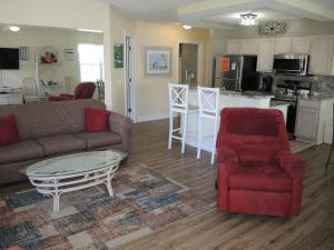 a living room with a couch and a coffee table at 507 villa in Calabash