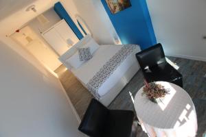 Кровать или кровати в номере Larimar Hotel Cesme