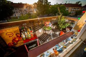 a view of a food stand on a balcony at Etage flat Stockholm Stora Essingen in Stockholm